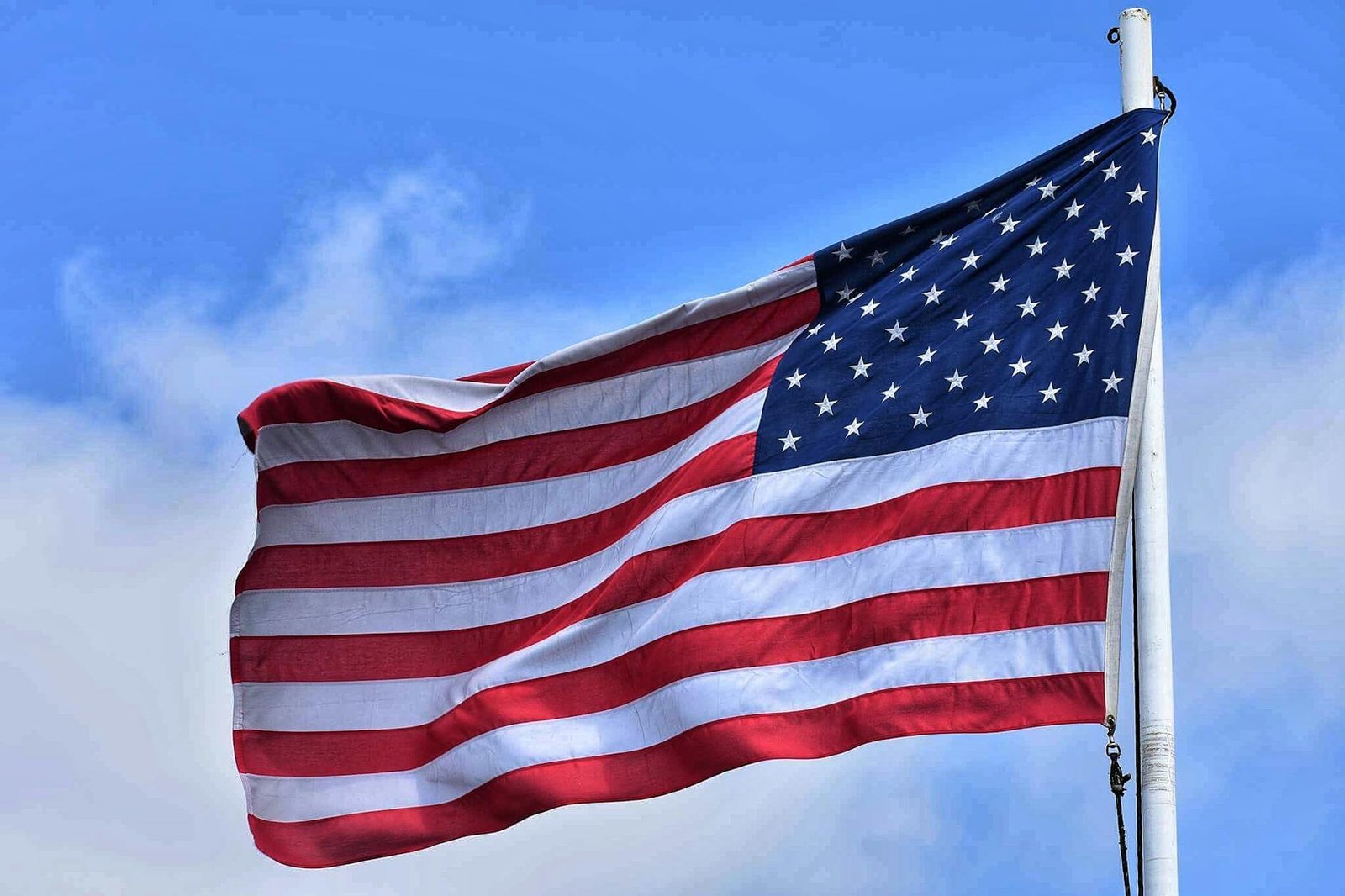 flag of u s displaying on pole