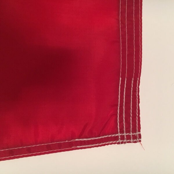 Texas Flag-close up of fly end edge and corner showing the tough stitching. Made in USA