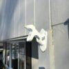 White Cast Aluminum 2 position flag pole Bracket mounted on home. Side view. Made in U.S.A.