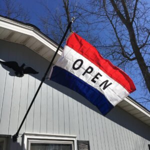 Open flag on side of building