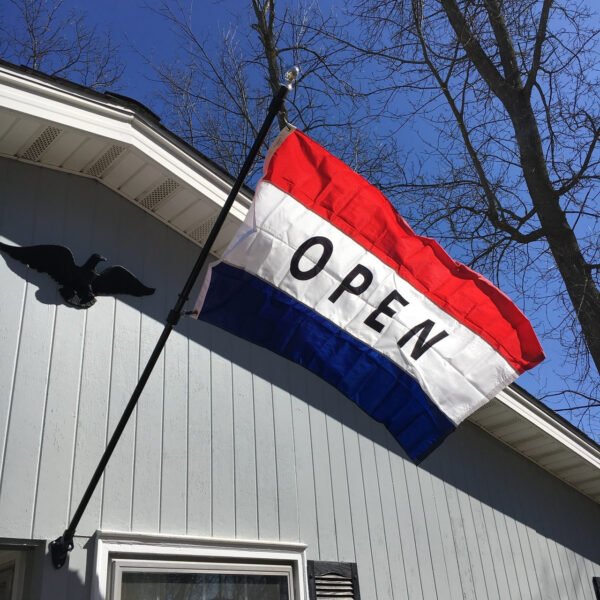 Open flag on side of building