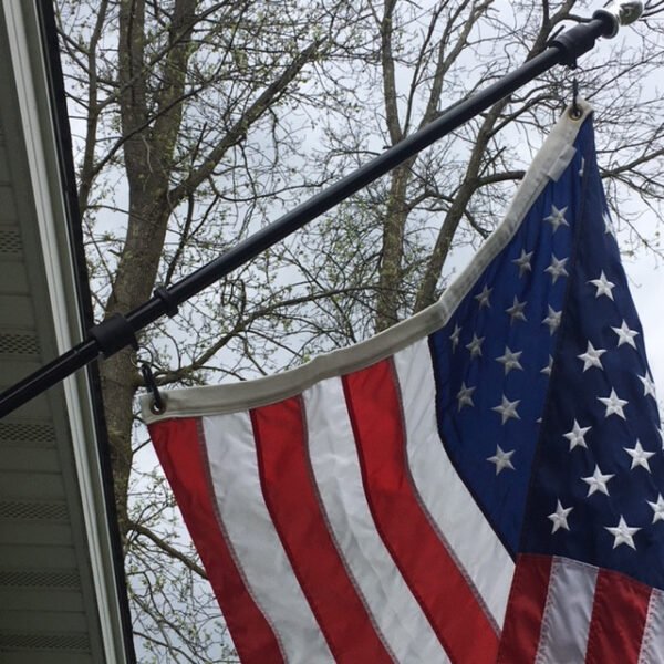 Showing the proper slack in the flag on the pole when Never-Furl is properly installed.