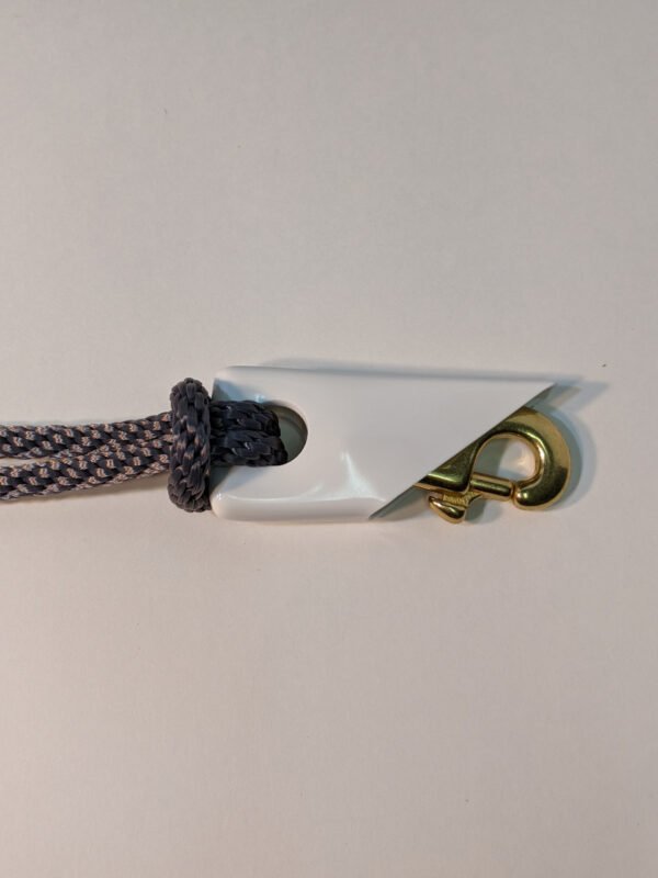 5/16" Silver Braided Polyester Halyard shown with 3" Cast Brass Snap and white snap cover (brass snap and snap cover sold separately) Made in USA