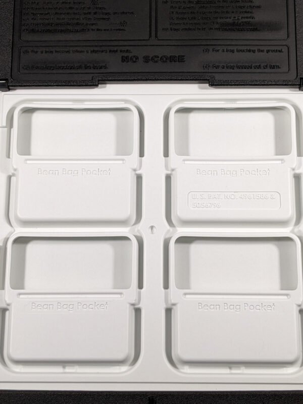 Underside of game board with storage pockets for bags. Cornhole Made in the USA