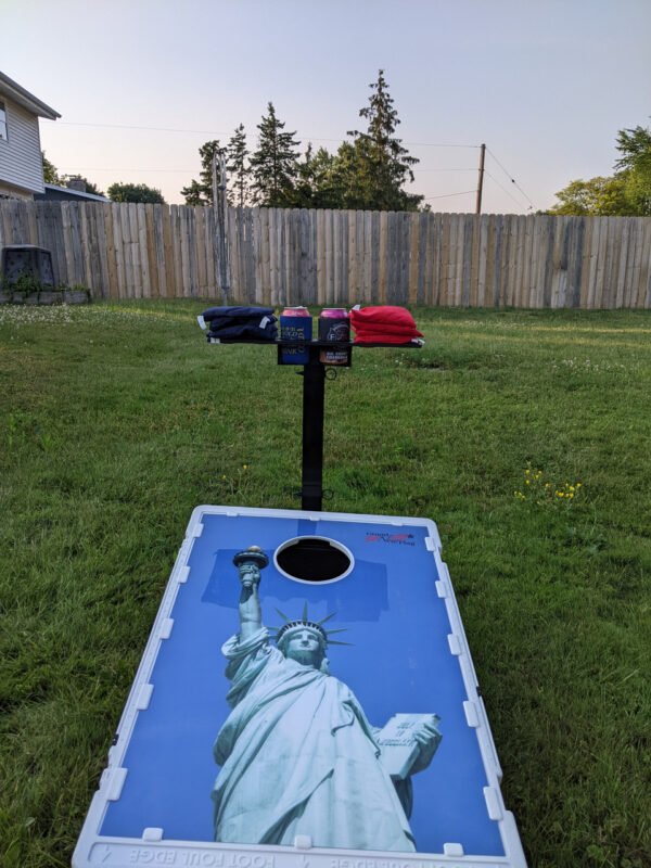 Cornhole caddy from front with bags and drinks with cornhole board