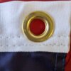 Brass grommets for hanging the 20"x8' U.S. flag pulldown Made in USA
