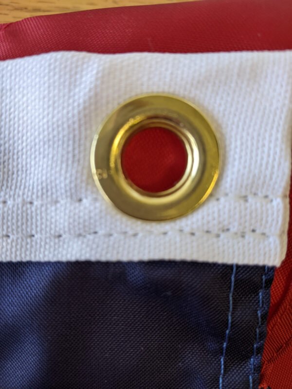 Brass grommets for hanging the 20"x8' U.S. flag pulldown Made in USA