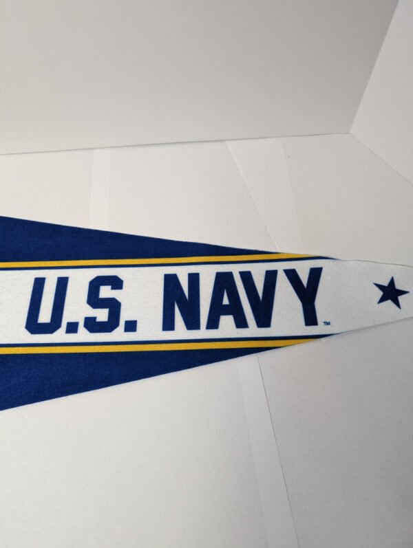 Text U.S. Navy on the tail end of the pennant Made in USA