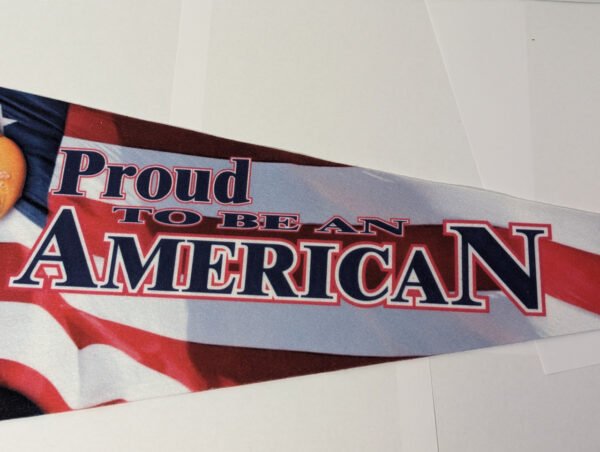 Tail end of pennant with the words Proud to be an American