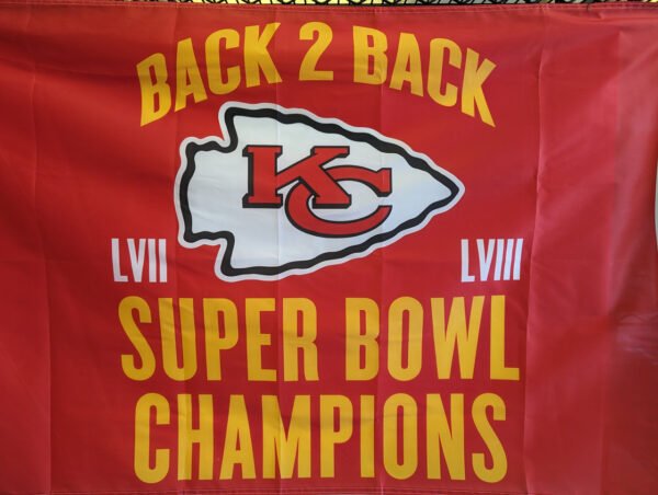 Clos up of Back 2 back Super Bowl Champions flag