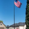 20' Titan Telescoping flagpole, Dark Bronze finish, fully raised with the Titan Solar light and American Flag. All Made in the USA.
