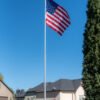 20' Titan Telescoping flagpole, Silver finish, fully raised with the Titan Solar light and American Flag. All Made in the USA.